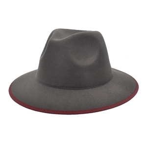 Detailed close-up of dark grey wool fedora hat with burgundy trim and classic crown