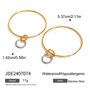 Detail of two-tone gold and silver stainless steel hoop earrings with size dimensions