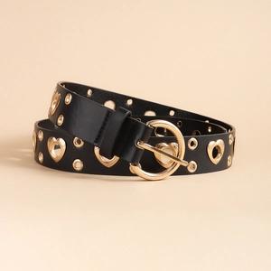 Detail of a black leather punk belt featuring golden heart-shaped eyelets and a round buckle