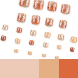 Caramel tone press-on toenails with glitter and marble effect on white background