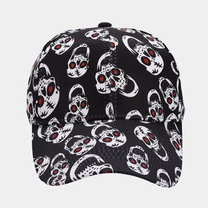 Close-up of the detailed red-eyed skull print on a black streetwear baseball cap