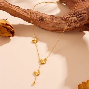 Golden butterfly tassel necklace with engraved butterfly pendants and steel beads