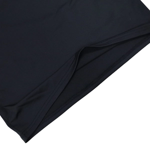 Detail shot of the black mesh dress showing clean double-stitch sewing and fabric texture