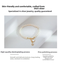 Close-up of S925 silver pearl bracelet featuring starfish and seashell charms