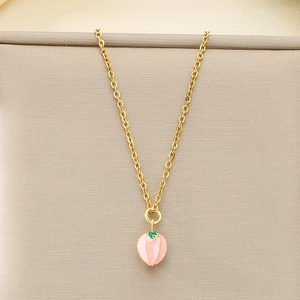 Detailed view of a gold stainless steel necklace with a pink peach oil-drip pendant
