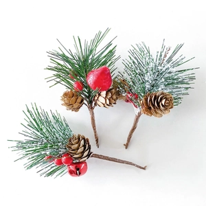 Christmas pine needle picks with natural cones, red berries and festive bells on white