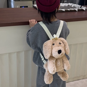 Cute khaki plush puppy backpack for kids with adjustable straps on a young child