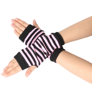 Pink and black striped knitted fingerless gloves worn by hands in a crossed pose