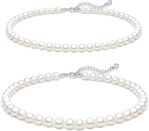 Detail of silver lobster clasp and extension chain on the white pearl necklace