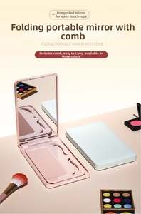 Detail showing portable folding compact mirror with an integrated foldable hair comb