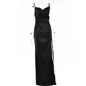 Detail of elegant black satin evening dress with thin straps and a sexy high side slit