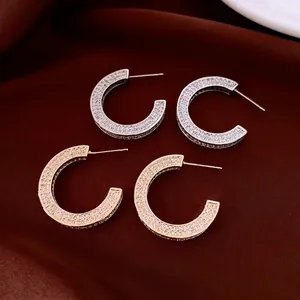 Classic C-shaped 14k gold plated hoop earrings with micro-pave white zircon stones