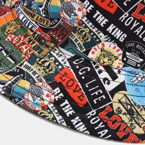Detail of colorful graffiti bucket hat showing dense stitching and cotton fabric texture