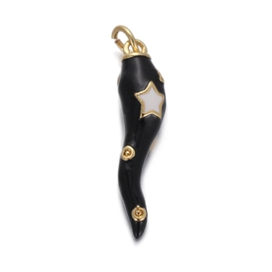 Macro view of black enamel chili charm with gold star inlay and polished metal finish