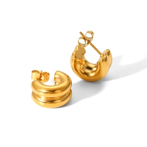 Close-up of dual-layer chunky C-shaped 18K gold-plated stainless steel hoop earrings