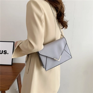 Fashionable light grey PU leather chain shoulder bag with minimalist V-shaped metal clasp