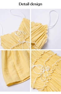 Detail design showing yellow pleated fabric texture and white drawstring on A-line dress