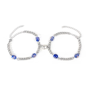 Detail of stainless steel Cuban link bracelets with blue beads and heart magnetic clasp