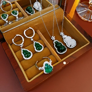 Exquisite jadeite and white jade gourd pendant necklaces and earrings in wood jewelry box