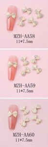 Detailed view of alloy bow nail charms with rhinestones and pearls measuring 11x7.5mm