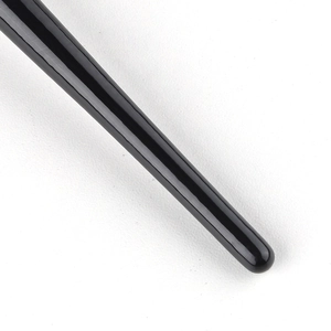 Detailed close-up of the sleek black glossy handle on this tapered makeup brush tool
