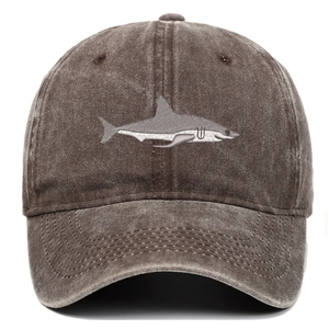 Detail of shark embroidery and washed cotton texture on vintage brown baseball cap