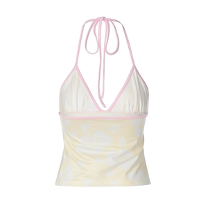 Detail view of floral halter top with pink trim and elegant neck tie fastening