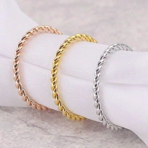 Three-color twisted rope stackable rings in gold, silver and rose gold stainless steel