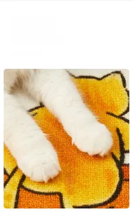 Close-up of durable looped pile cat scratching mat with cute yellow cartoon design