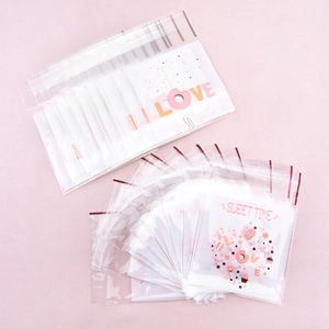 Pink cartoon self-adhesive treat bags for cookies with sweet time and heart pattern design