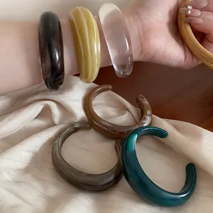 Minimalist acrylic resin open bangle set with marble patterns and polished finish