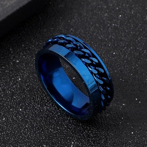 Blue stainless steel spinner ring with inlaid chain design and Roman numerals marking