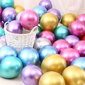 Assorted chrome metallic latex balloons in a white basket for festive decoration