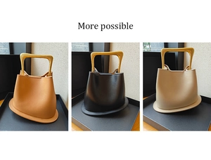 Three leather bucket bags in khaki, black, and beige with unique golden metal handles
