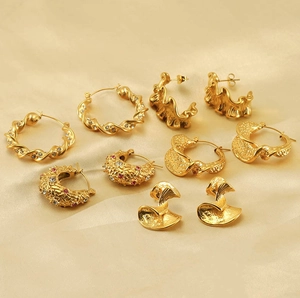 Collection of 18k gold plated stainless steel hoop earrings on elegant silk fabric