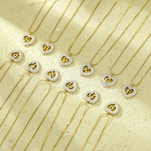 Gold heart initial necklace with sparkling zircon pavé for a trendy minimalist look