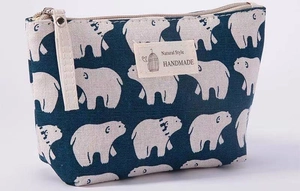 Detail of navy blue canvas bag with white polar bear print and Natural Style tag