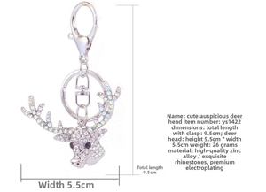 Macro detail of deer head keychain with sparkling rhinestones and lobster clasp on silver base