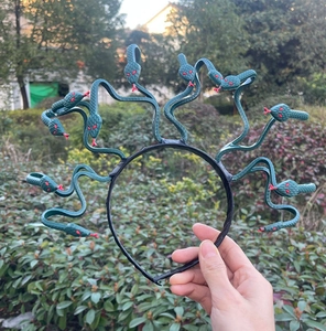 Detail of dark green Medusa snake headband for Halloween and cosplay themes