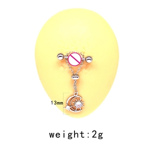 Detailed view of stainless steel nipple ring with moon and sun charms on a model
