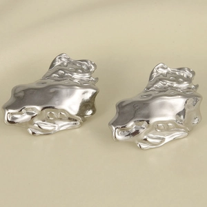Detailed view of silver irregular lava texture earrings in 304 stainless steel