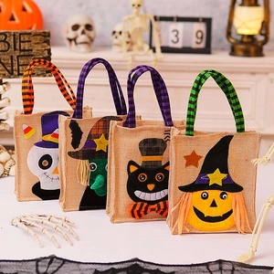 Halloween burlap gift bags with pumpkin, witch, and ghost designs for holiday party favors