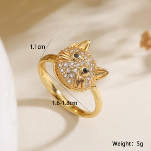 Detailed macro view of 18K gold-plated cat ring with cubic zirconia and black eyes