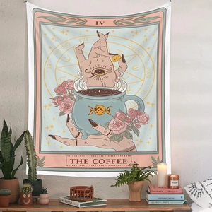 Detail of tarot style tapestry featuring pink roses and moon phases on a cozy wall