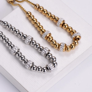 Adjustable stainless steel beaded bracelet with rhinestone spacers in gold and silver