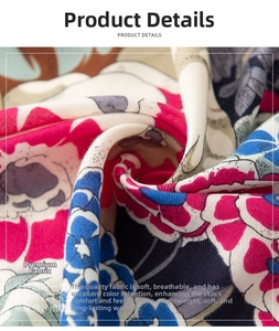 Close-up of geometric floral print silk scarf showing soft texture and vibrant colors