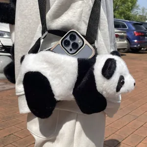 Close-up of a panda plush crossbody bag showing texture and adjustable black strap