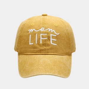 Detail of mom LIFE white embroidery on vintage washed cotton mustard baseball cap