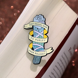 Funny sage enamel pin with quote on book background and vintage bokeh lighting