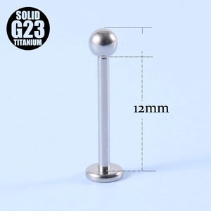 Detailed view of 12mm G23 titanium barbell piercing with flat back and ball top